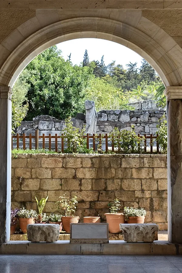 An arched opening in the Stoa of Attalos looking out over the excavations